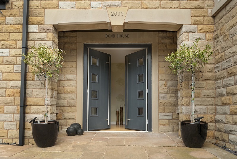 A cream brick house with grey composite doors in Fareham.